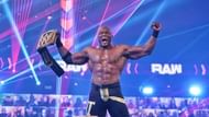 Bobby Lashley posing with the WWE Title a week before winning it